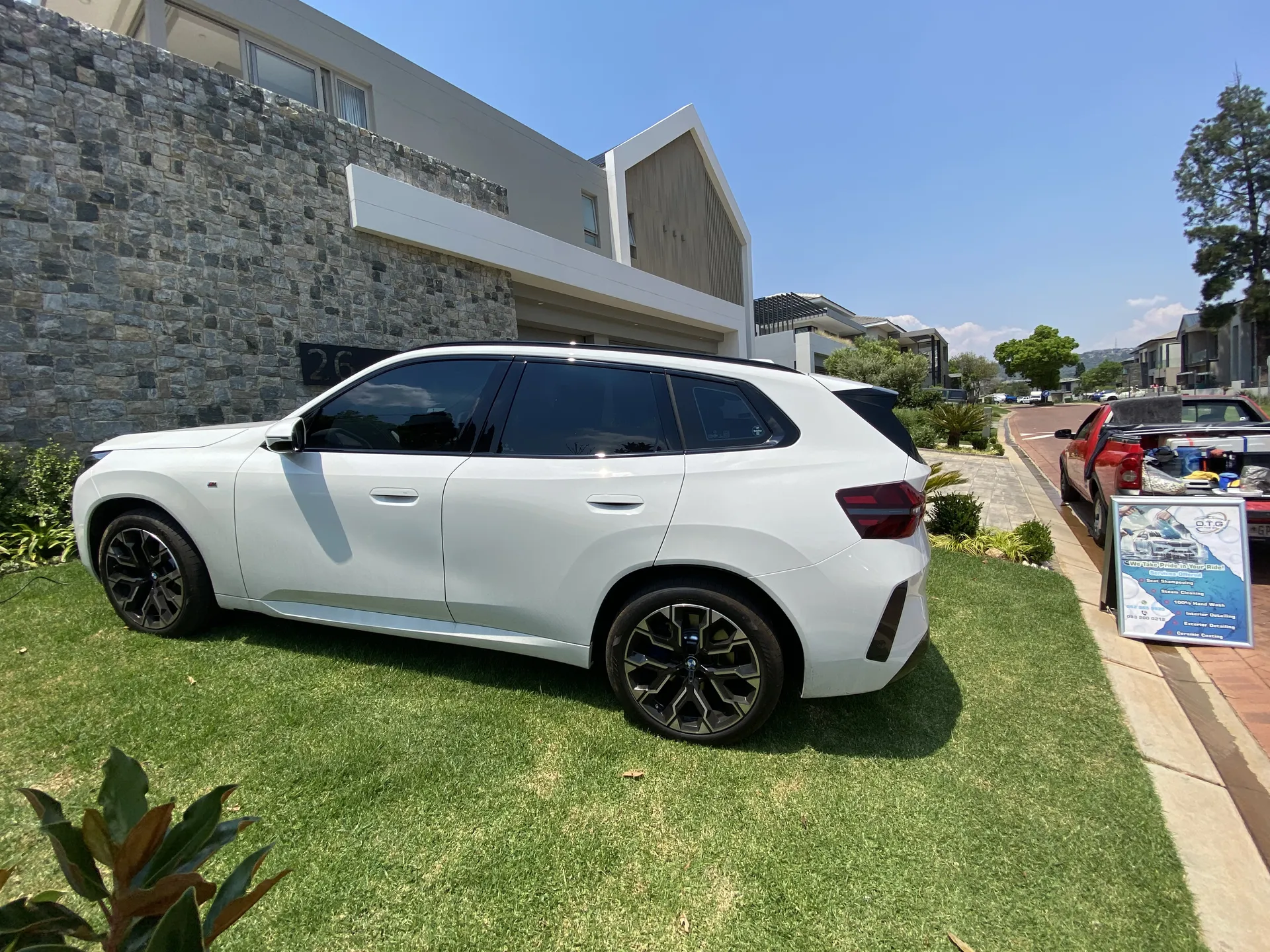 BMW X5 detailed at a client home in Johannesburg next to the OTG Mobile Detailing sign